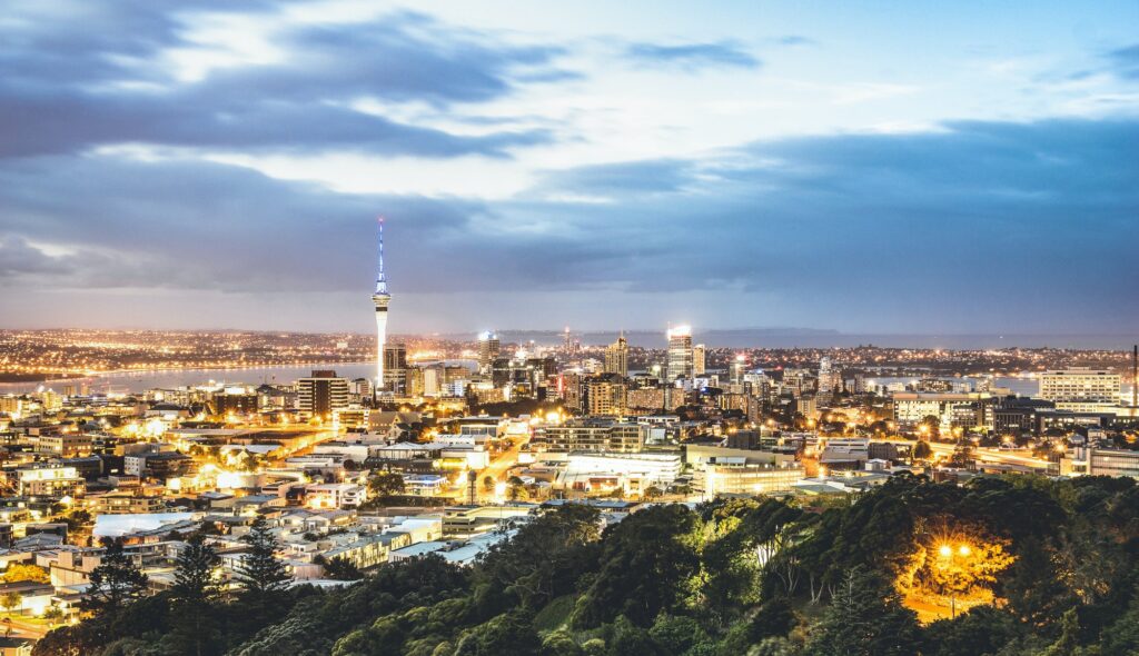 Aerial view of Auckland skyline from Mount Eden after sunset during blue hour
